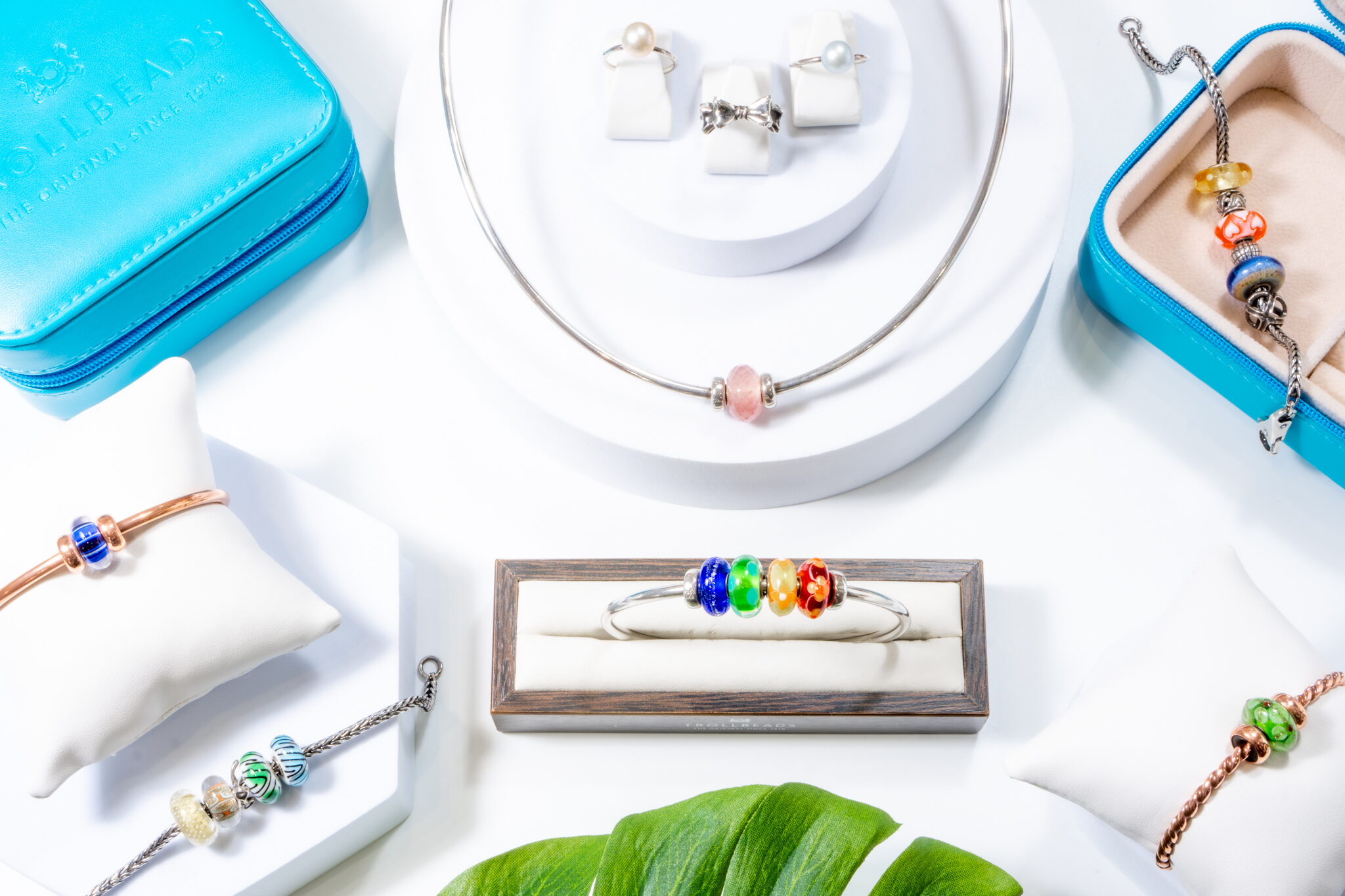 Parrys of Malvern jewellery flat lay with bracelets and charms