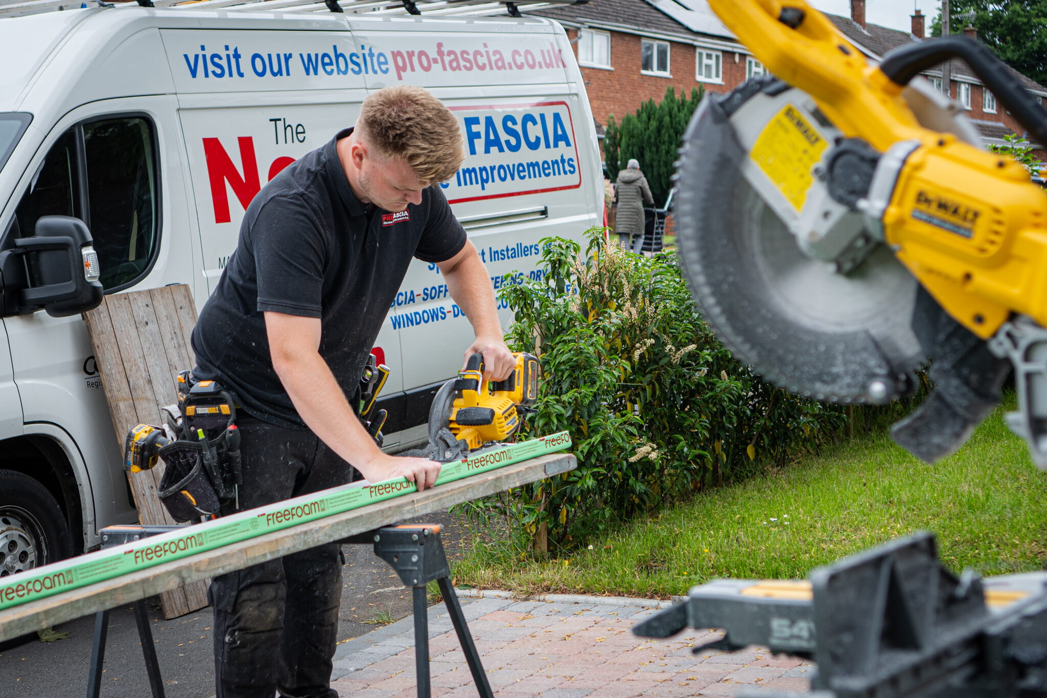 Pro-Fascia fitter cutting fascia board on site